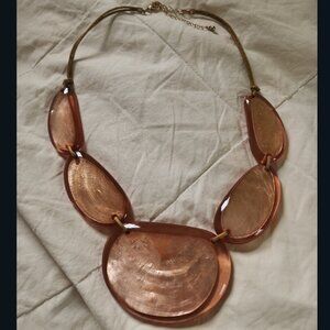 Necklace with peach swirled glass
